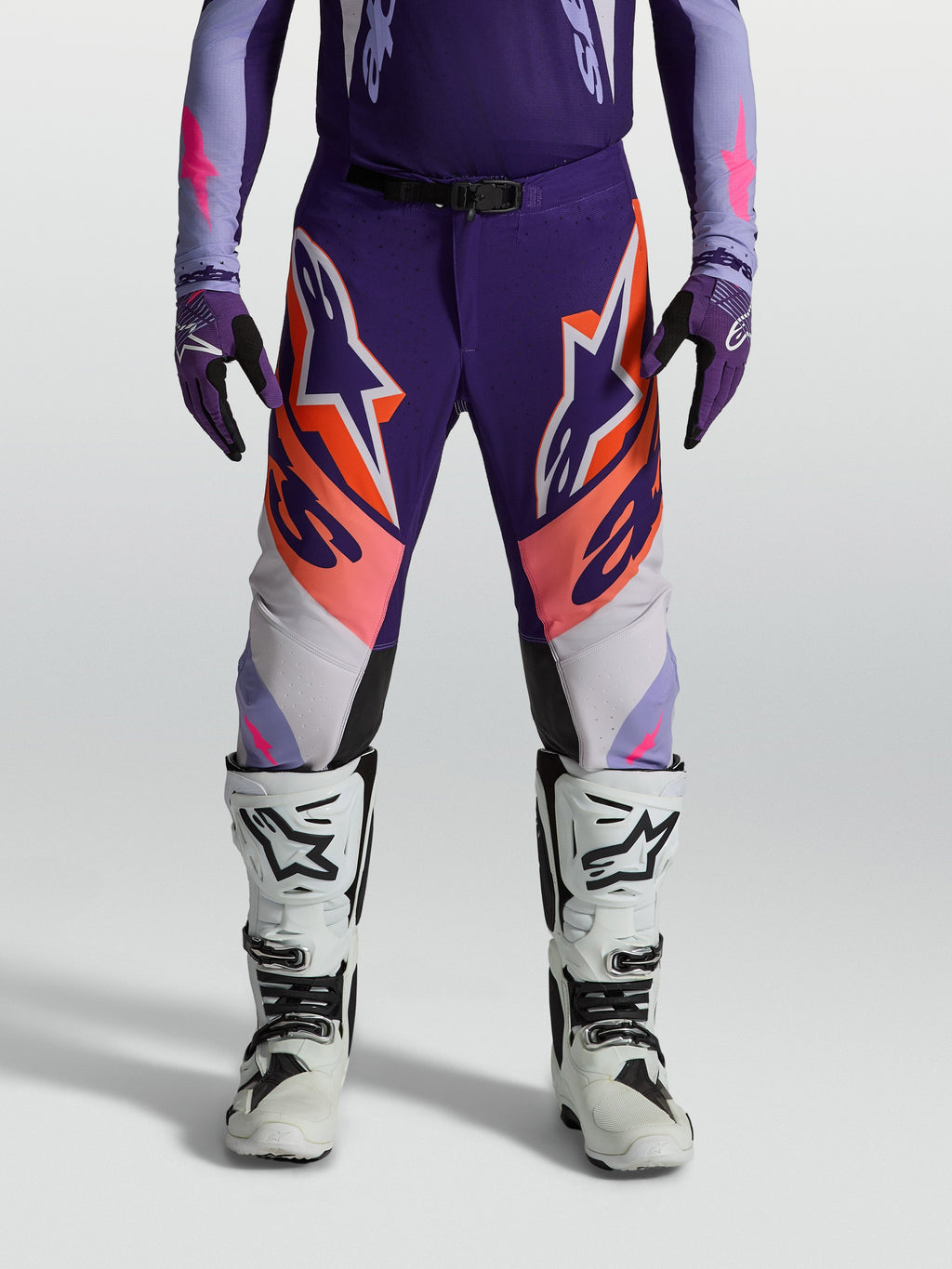 Alpinestars Supertech Dyna, pantalones de motocross para hombre, morados y rosa flúor, con ajuste atlético y tejido ripstop.