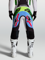 Pantalones Alpinestars Supertech Dyna para motocross de hombre, lila y verde flúor, con paneles perforados, vista trasera