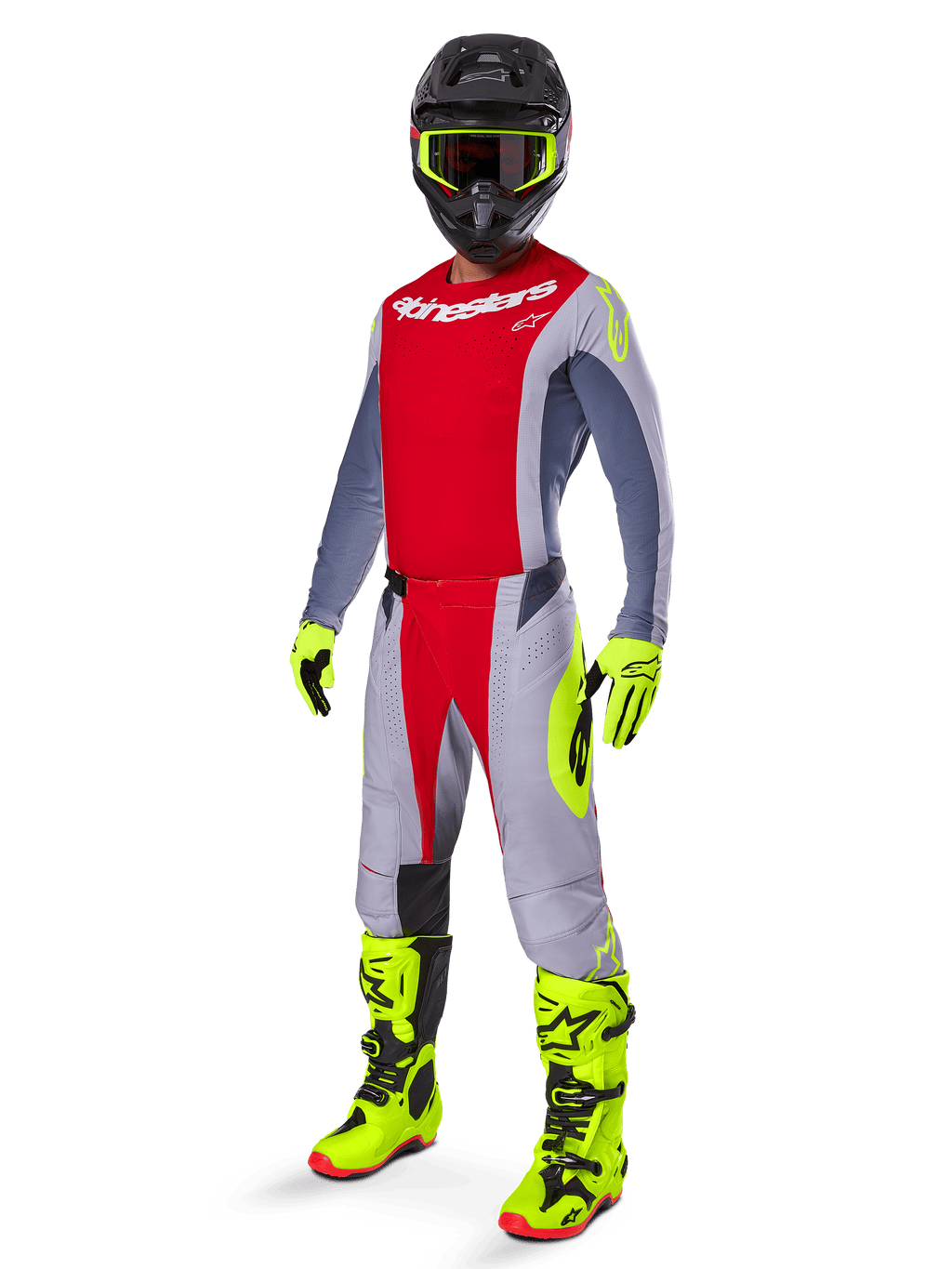 Piloto de motocross con el conjunto Alpinestars 2025 Techstar Melt, jersey y pantalones rojos y grises, guantes y botas amarillo neón vibrante, casco negro, kit completo de competición todoterreno