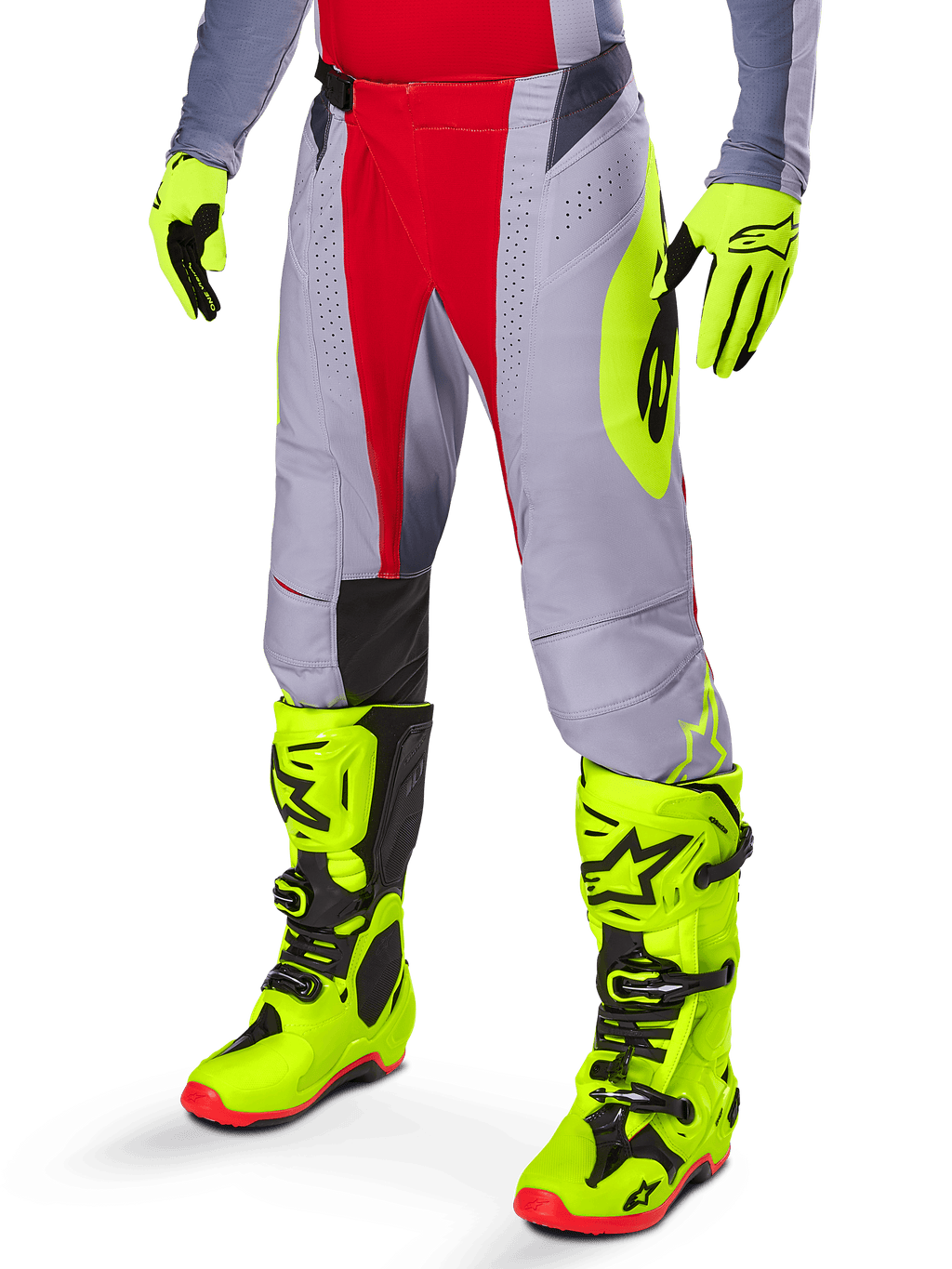Alpinestars Techstar Melt Pants 2025, pantalones de motocross en rojo brillante y gris, con gráficos laterales en amarillo neón y paneles negros en las rodillas, combinados con botas y guantes amarillo neón a juego, diseñados para un rendimiento competitivo off-road