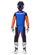Motocross rider wearing complete racing gear, Alpinestars 2025 Techstar Melt Gear Set, Blue and Orange, blue jersey with orange sleeves, matching pants with white logos, black helmet with blue goggles, white and black boots and gloves, coordinated outfit for off-road racing