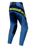Alpinestars Techstar Melt Pants 2025, pantalones de motocross, amarillo flúor y azul, vista trasera con gran logotipo en amarillo fluorescente en la parte posterior, paneles azul marino, logos de estrella en los muslos y refuerzos interiores negros en las rodillas