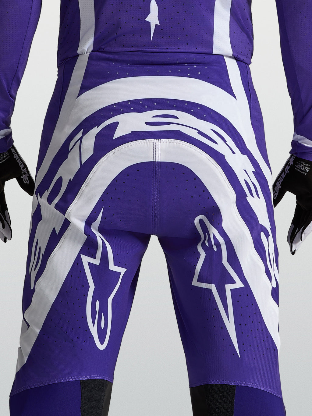 Pantalones Alpinestars Supertech Vesta, motocross para hombre, azul y blanco, vista trasera con logos y perforaciones