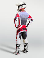 Alpinestars Techstar Maven Pants, Men's Motocross Racing Gear, Fire Red and White, rear view on rider with matching jersey.