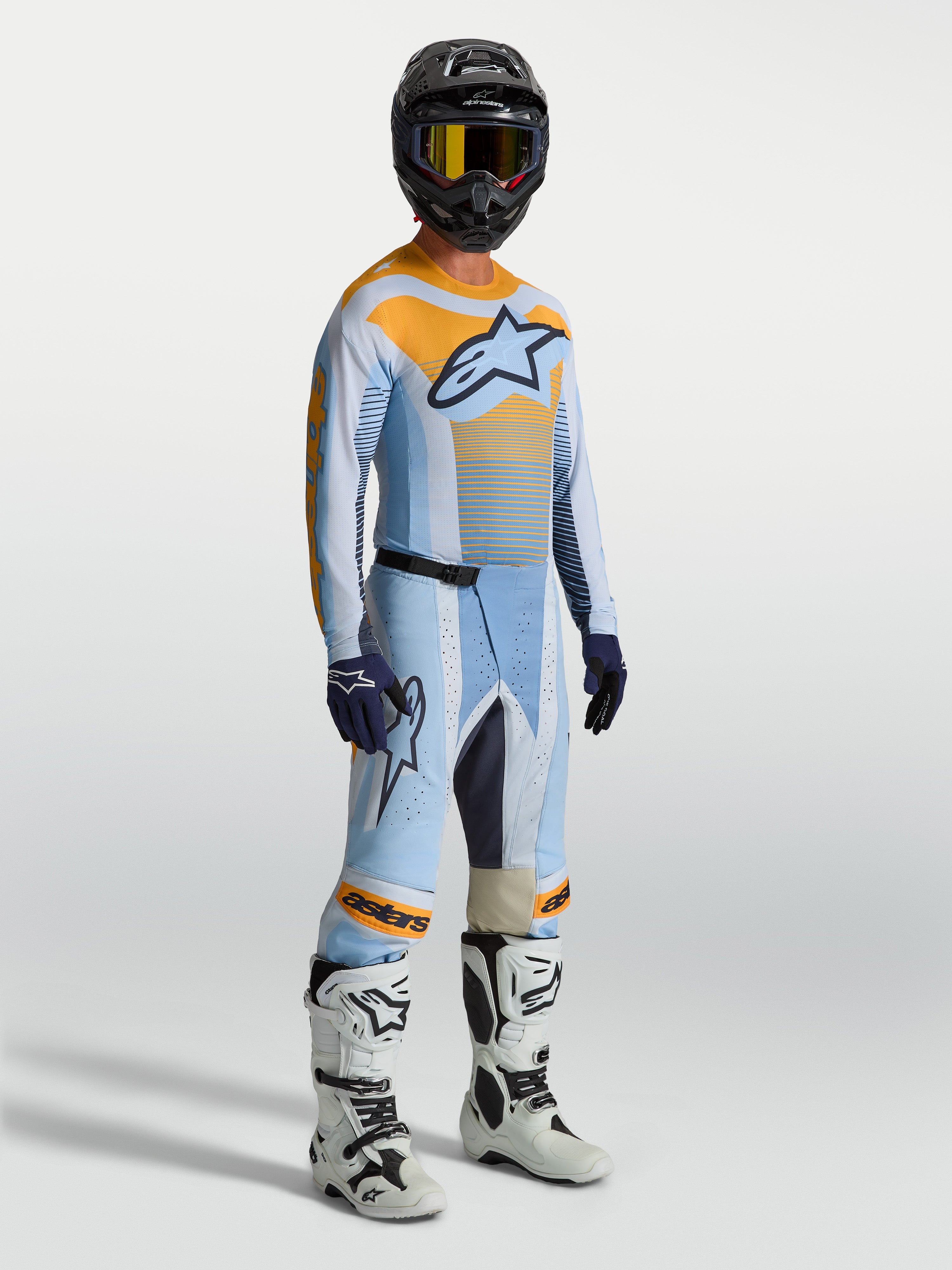 Pantalones Alpinestars Techstar Maven de motocross para hombre, azul y naranja, ajuste atlético de carreras con zonas elásticas.