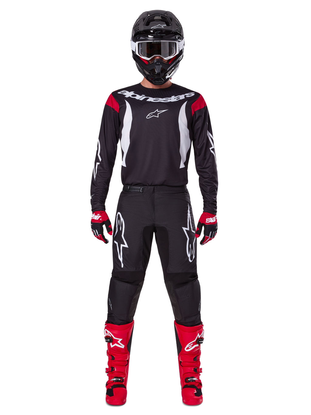 Alpinestars 2025 Fluid Haul Gear Set, Motocross rider in full racing gear, black jersey with red shoulder accents and white logos, black pants with white star branding, bright red boots, red and black gloves, black helmet with white goggles, coordinated off-road performance look