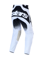 Pantalones Alpinestars Techstar Swan de motocross, blancos y negros, vista trasera con rodillas de cuero y ajuste de carrera
