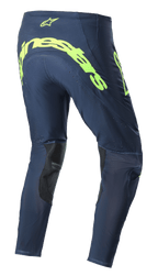 Alpinestars 2023 Supertech Bruin Pants, pantalones de motocross, azul noche y amarillo flúor, vista trasera con el gran logotipo de Alpinestars en amarillo flúor en el asiento, zonas de ventilación perforadas y refuerzos negros en el interior de la pierna.