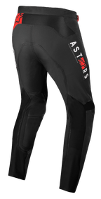 Pantalones Alpinestars Supertech Foster, pantalones de motocross, negros, con marca vertical ASTARS en blanco y logotipos de estrella en rojo, construcción textil de alto rendimiento con paneles de malla para ventilación y libertad de movimiento