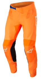 Alpinestars Supertech Foster Pants, pantalones de motocross, naranja y negro, con hebilla azul en la cintura, logotipos de estrella blancos en las rodillas, paneles reforzados en el interior de la pierna y ventilación de malla técnica