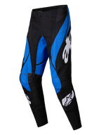 Alpinestars Techstar Dreem Pants 2025, pantalones de motocross, negro y azul, con logotipos de Alpinestars en blanco, llamativos paneles azules angulares sobre una base negra, diseño atlético con zonas de las rodillas reforzadas para rendimiento todoterreno