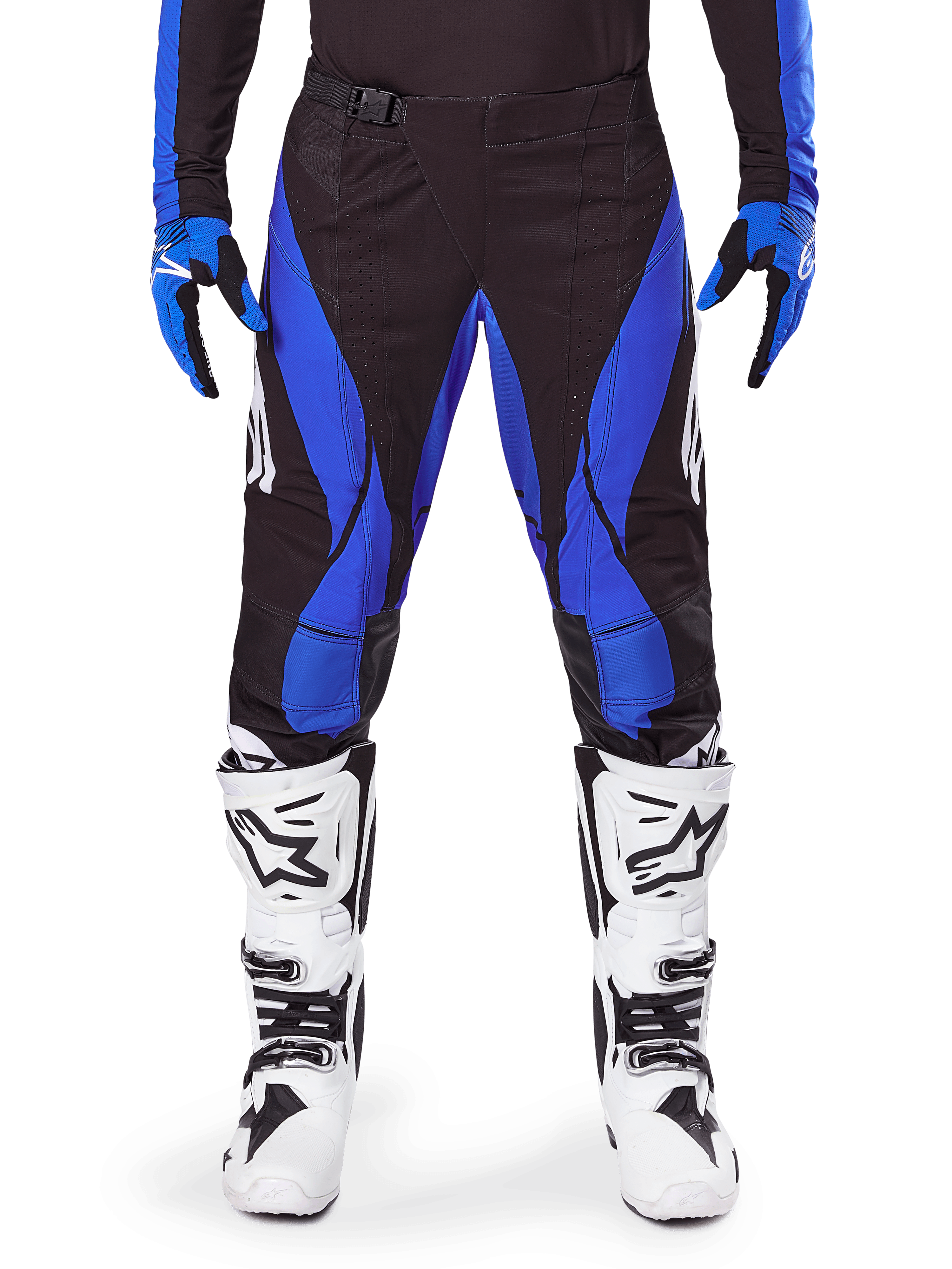 Alpinestars 2025 Techstar Dreem Pants, pantalones de motocross, negros y azules, usados con jersey, guantes a juego y botas blancas, con paneles laterales azules y ajuste atlético de competición, material resistente para carreras off-road