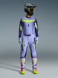 Alpinestars 2026 Supertech Scenz Gear Set, Motocross Racing Outfit, Light Purple and Neon Yellow-Green, full protective gear including black helmet with purple accents, jersey with bold neon yellow branding, matching pants with star graphics, and coordinated boots with pink highlights.