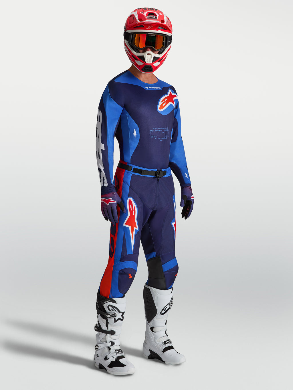 Pantalones Racer Hunt de Alpinestars, equipo de motocross para hombre en azul y rojo, con ajuste ergonómico y precurvado.