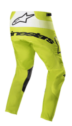 Alpinestars 2023 Techstar Push Pants, pantalones de motocross, amarillo flúor y blanco, vista trasera de tres cuartos con logotipos en negro y panel trasero blanco con el logo de la estrella, parches negros en el interior de las piernas, equipo duradero para carreras todoterreno