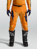 Alpinestars Racer Amber, pantalones de motocross para hombre, naranjas y azules oscuros, tejido 600D y ajuste de carrera.