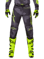 Alpinestars 2025 Racer Hollow Pants, pantalones de motocross, gris oscuro con detalles amarillo neón, diseños de estrellas amarillas brillantes, equipo de protección para todoterreno, estilo deportivo con alta visibilidad