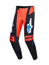Alpinestars 2026 Techstar Knif Pants, Motocross Pants, Orange Black and UCLA Blue, featuring large blue and white Alpinestars logos on the thighs, "astars" text on the knees, black leather inner knee panels, and a sleek athletic fit for off-road racing.