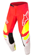 Alpinestars Techstar Factory Pants, Motocross Racing Pants, Red with Fluo Yellow and White accents, featuring black inner knee panels, large Alpinestars logos, perforated ventilation holes, and a black adjustable waist buckle.