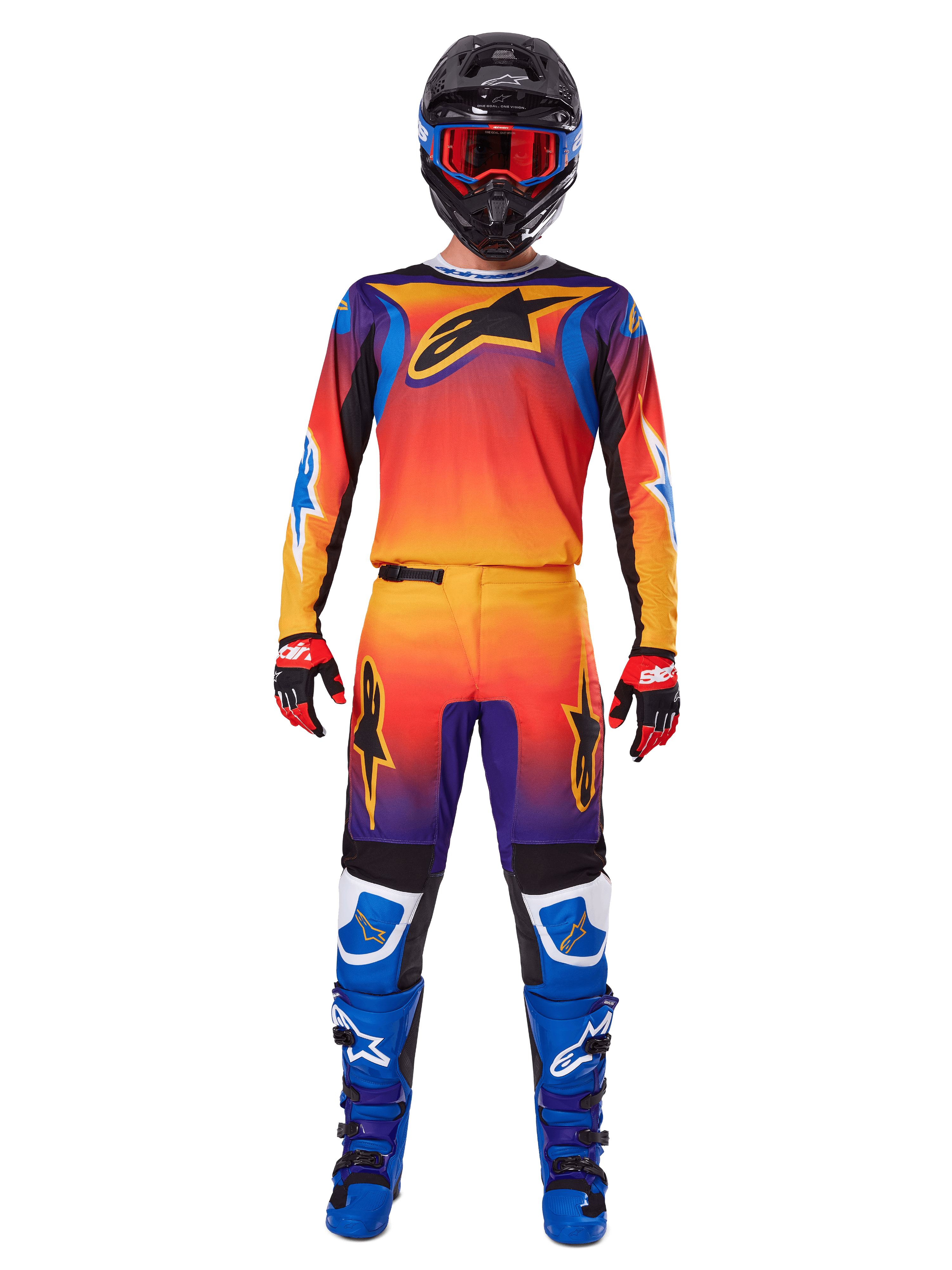 Pantalones Alpinestars Fluid Wurx 2025, pantalones de motocross, degradado multicolor en naranja, amarillo y púrpura, usados con el jersey a juego, casco negro con gafas azules, guantes rojos y negros, y botas azules, equipo de motocross coordinado.