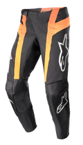 Alpinestars Pantalones Techstar Sein 2023, pantalones de motocross, negros y naranja intenso, con paneles verticales naranjas y ventilación perforada, áreas de las rodillas reforzadas en cuero, logos plateados en los muslos y las espinillas, y diseño de ajuste de carrera.