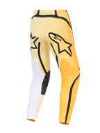 Alpinestars 2026 Fluid Apex Pants, pantalones de motocross, amarillos y negros con detalles blancos, vista trasera con un prominente logotipo Astars en negro, diseño asimétrico con paneles reforzados duraderos y ajuste precurvado.