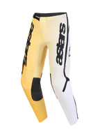 Alpinestars 2026 Fluid Apex Pants, pantalones de motocross, amarillos, blancos y negros, con un esquema de color degradado, logotipo vertical de astars en los muslos, paneles reforzados negros en las rodillas y diseño ergonómico precurvado para rendimiento off-road.