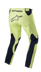 Pantalones Alpinestars Racer Hoen 2023, pantalones de motocross, verde fluorita y azul noche, vista trasera con chasis verde neón y paneles azul marino en las piernas, gran logotipo de estrella negro en la zona del asiento, diseño ergonómico precurvado para carreras off-road