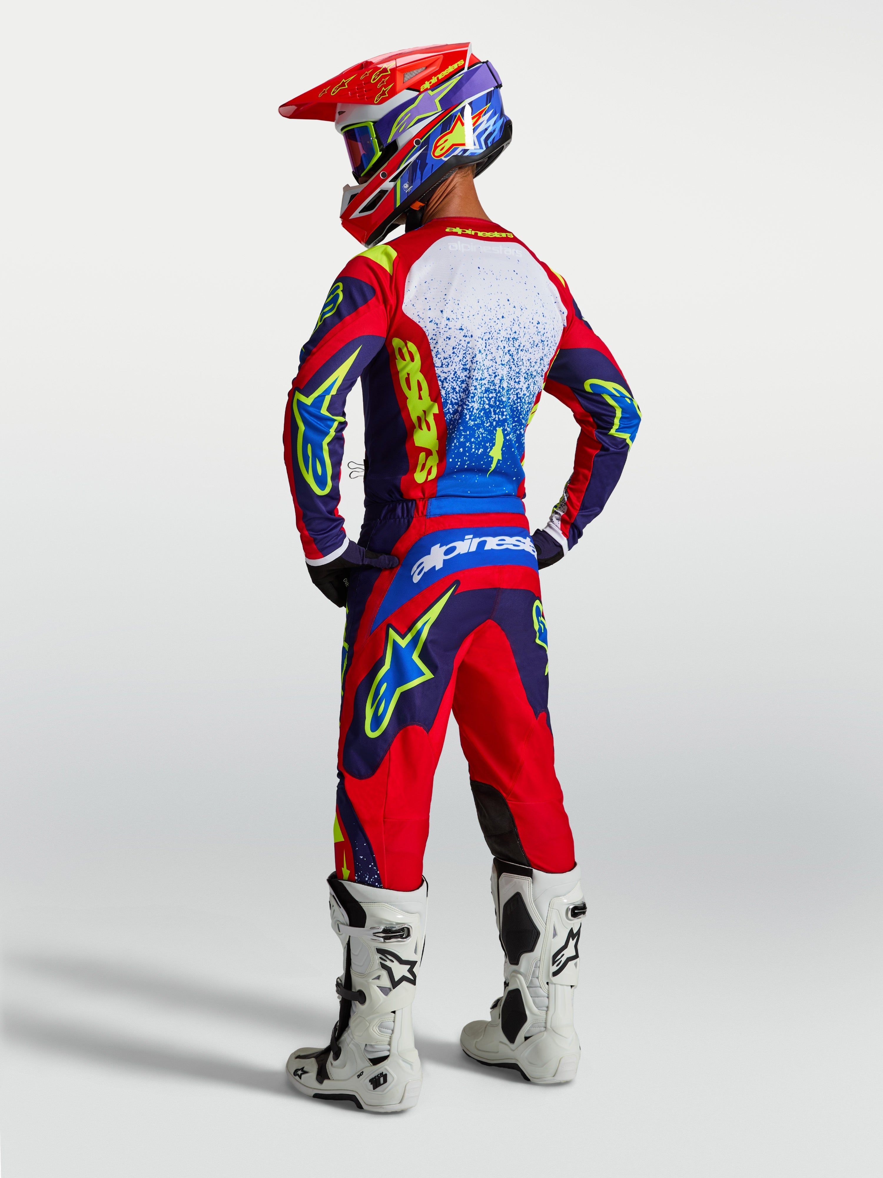 Alpinestars 2027 Fluid Drag Gear Set and Pants, Motocross Racing Outfit, Blue Navy, Fire Red, and White, Rear View.
