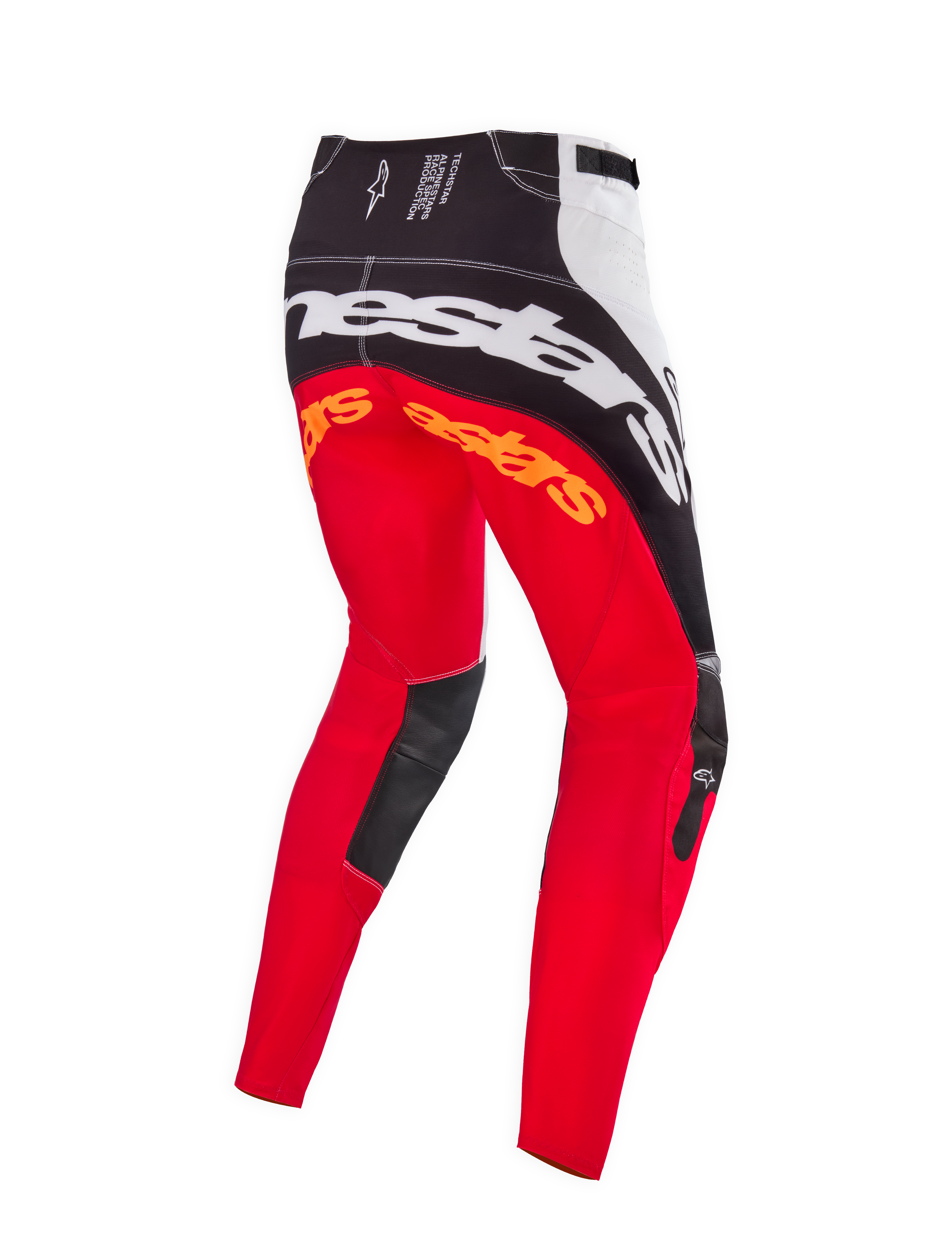 Pantalones de motocross Alpinestars Techstar Deep Edición Limitada, en color negro, blanco y rojo intenso, vista posterior con gran marca Alpinestars blanca en el asiento, logotipos naranjas en la parte superior de las piernas y paneles de cuero negro en el interior de las rodillas, diseñados para competición profesional off-road.