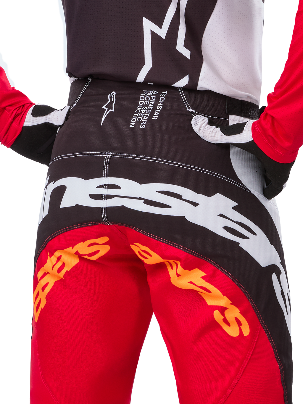 Alpinestars Techstar Deep Edición Limitada, pantalones de motocross, negro, blanco y rojo vibrante, con diseño de múltiples paneles, logo Alpinestars en la parte posterior y paneles elásticos en 4 direcciones para rendimiento off-road