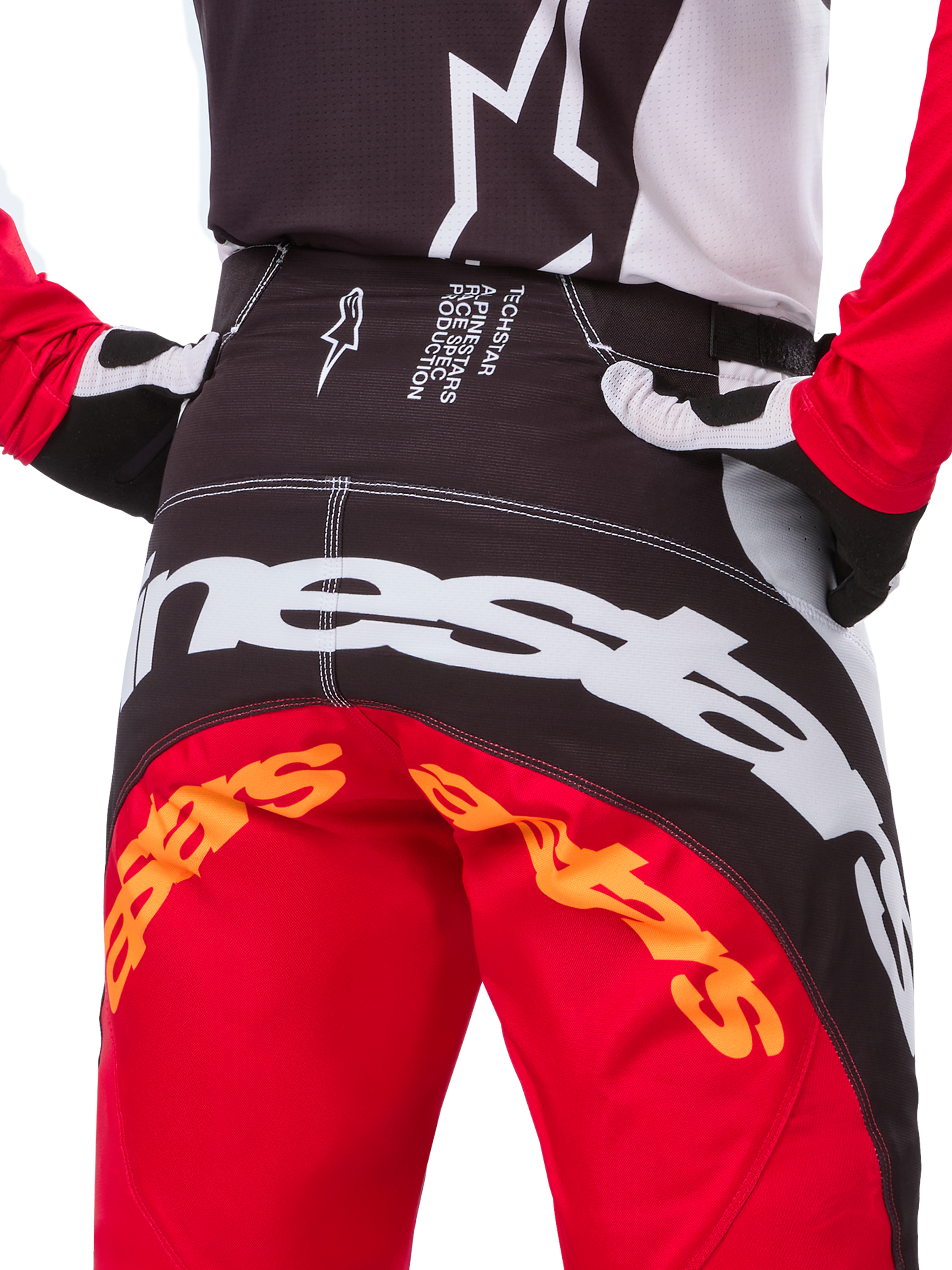 Alpinestars Techstar Deep Edición Limitada, pantalones de motocross, negro, blanco y rojo vibrante, con diseño de múltiples paneles, logo Alpinestars en la parte posterior y paneles elásticos en 4 direcciones para rendimiento off-road