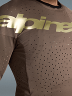 Jersey Alpinestars Supertech Air Gold de edición limitada para motocross, marrón y dorado, con perforaciones láser