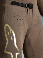 Pantalones Supertech Air Gold Edición Limitada, marrones con logo dorado y hebilla magnética SX1 para motocross Alpinestars