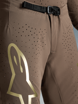 Pantalones Supertech Air Gold Edición Limitada, marrones con logo dorado y hebilla magnética SX1 para motocross Alpinestars