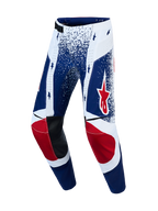 Alpinestars Techstar Unity, pantalones de motocross de edición limitada, azules y blancos con detalles de estrellas rojas.