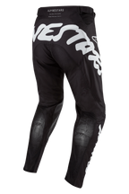 Alpinestars 2024 Racer Hana Pants, pantalones de motocross negros con grandes gráficos blancos en la parte trasera, diseño ergonómico con paneles elásticos y materiales técnicos para conducción fuera de carretera