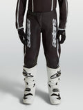 Alpinestars pantalones Fluid Apex V2 juvenil, motocross, negro y plateado, politejido 600D con diseño ergonómico precurvado.