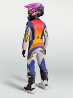 Alpinestars pantalones Fluid Drag Juvenil, pantalones de motocross en azul y dorado, vista trasera con tejido de poliéster duradero y ajuste ergonómico