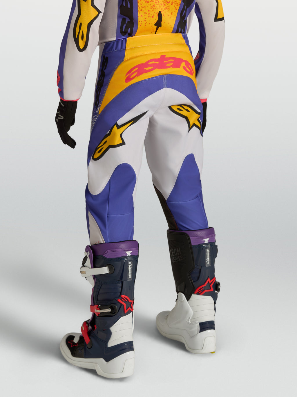 Pantalones Alpinestars Fluid Drag Juvenil para motocross en azul y blanco, con construcción resistente de poli-tejido 600D.