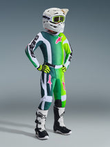 Alpinestars 2026 Youth Fluid Portl Pants, Motocross Pants, Green White and Black, youth rider wearing complete off-road gear with matching gradient jersey, pink star logos, white helmet, and white and black boots, coordinated racing outfit.