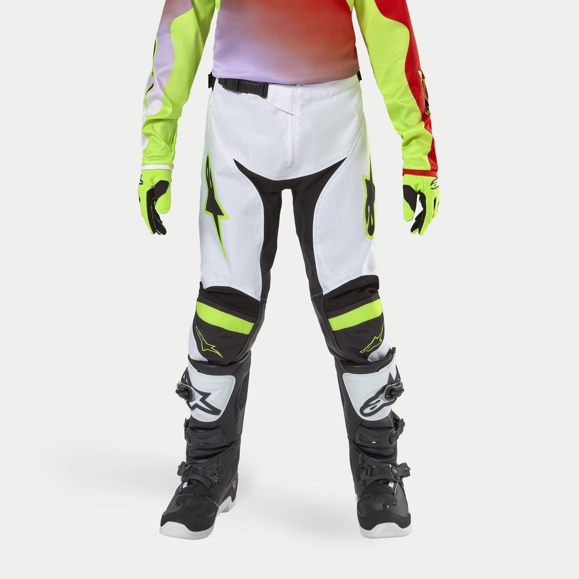 Alpinestars Youth 2024 Racer Lucent Pants, Motocross Pants, White with Neon Yellow and Black accents, worn with coordinating neon gloves and black boots, featuring ergonomic pre-curved legs and Alpinestars logos, high-performance gear for off-road racing