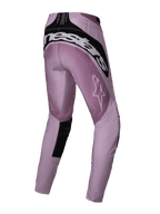 Alpinestars Stella Techstar Melt Pants 2025, pantalones de motocross para mujer, rosa y negro, vista trasera de tres cuartos que muestra la marca blanca de Alpinestars en la parte posterior, tejido antidesgarro rosa con detalles negros, diseñados para competición off-road de alto rendimiento