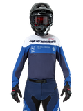 Alpinestars Pro-Dura Jersey, Motocross and Enduro Jersey, Navy, Bright Blue, and White, worn with matching navy pants, black gloves and helmet, featuring chest branding and laser-cut ventilation for off-road motorcycle racing