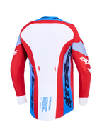 Alpinestars Supertech Dyna, jersey de motocross para hombre, rojo, blanco y azul marino, vista trasera con dobladillo trasero extendido.
