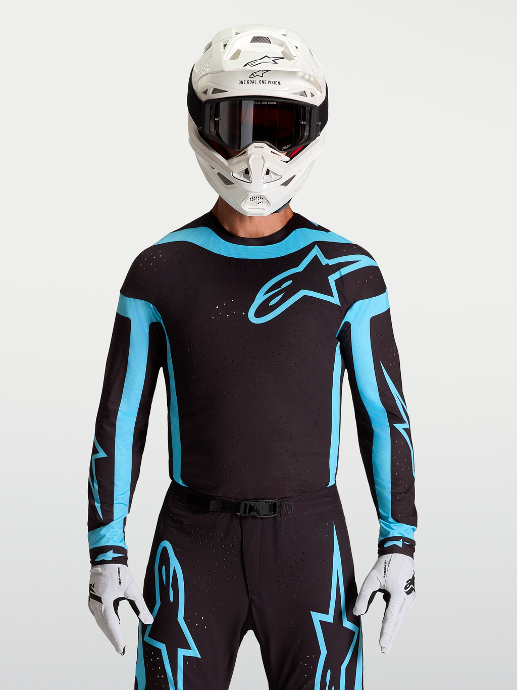 Jersey Supertech Vesta de Alpinestars, jersey de motocross para hombre, negro y turquesa con ventilaciones láser transpirables.