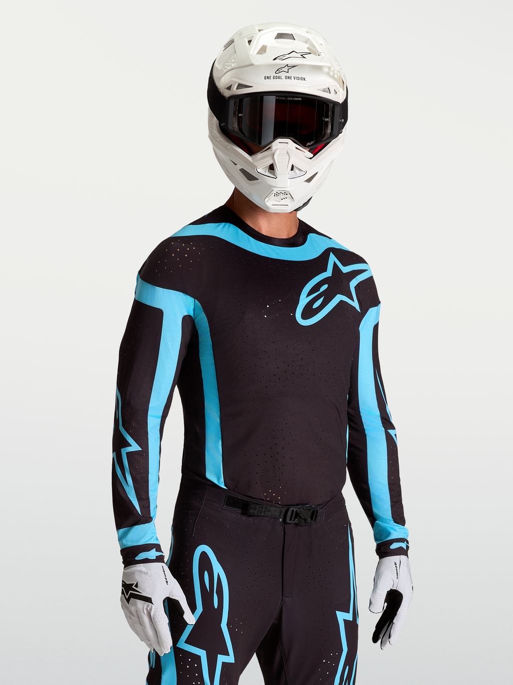 Jersey Alpinestars Supertech Vesta, jersey de motocross para hombre, negro y turquesa, con perforaciones láser y ajuste atlético.