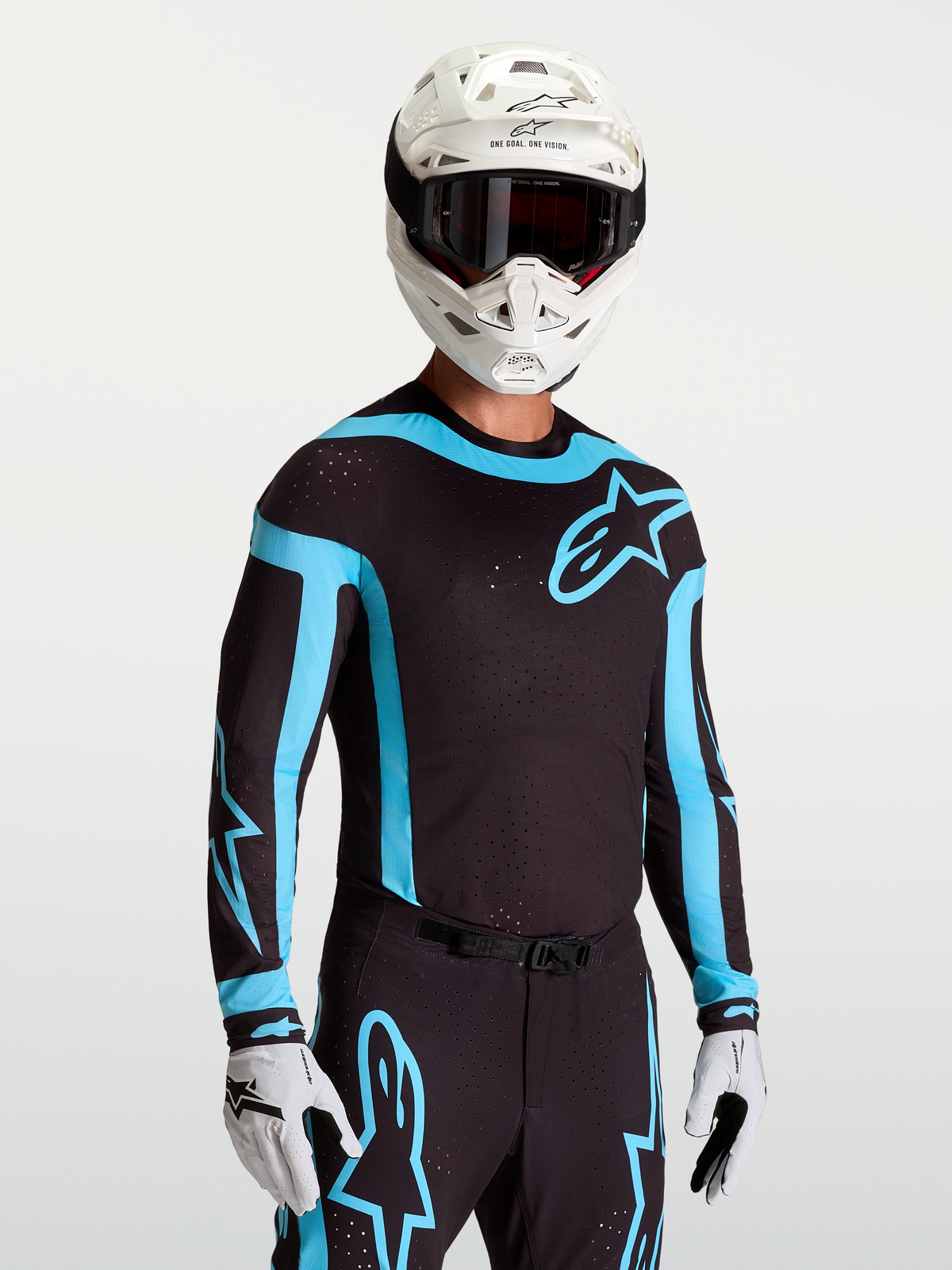 Jersey Alpinestars Supertech Vesta, jersey de motocross para hombre, negro y turquesa, con perforaciones láser y ajuste atlético.