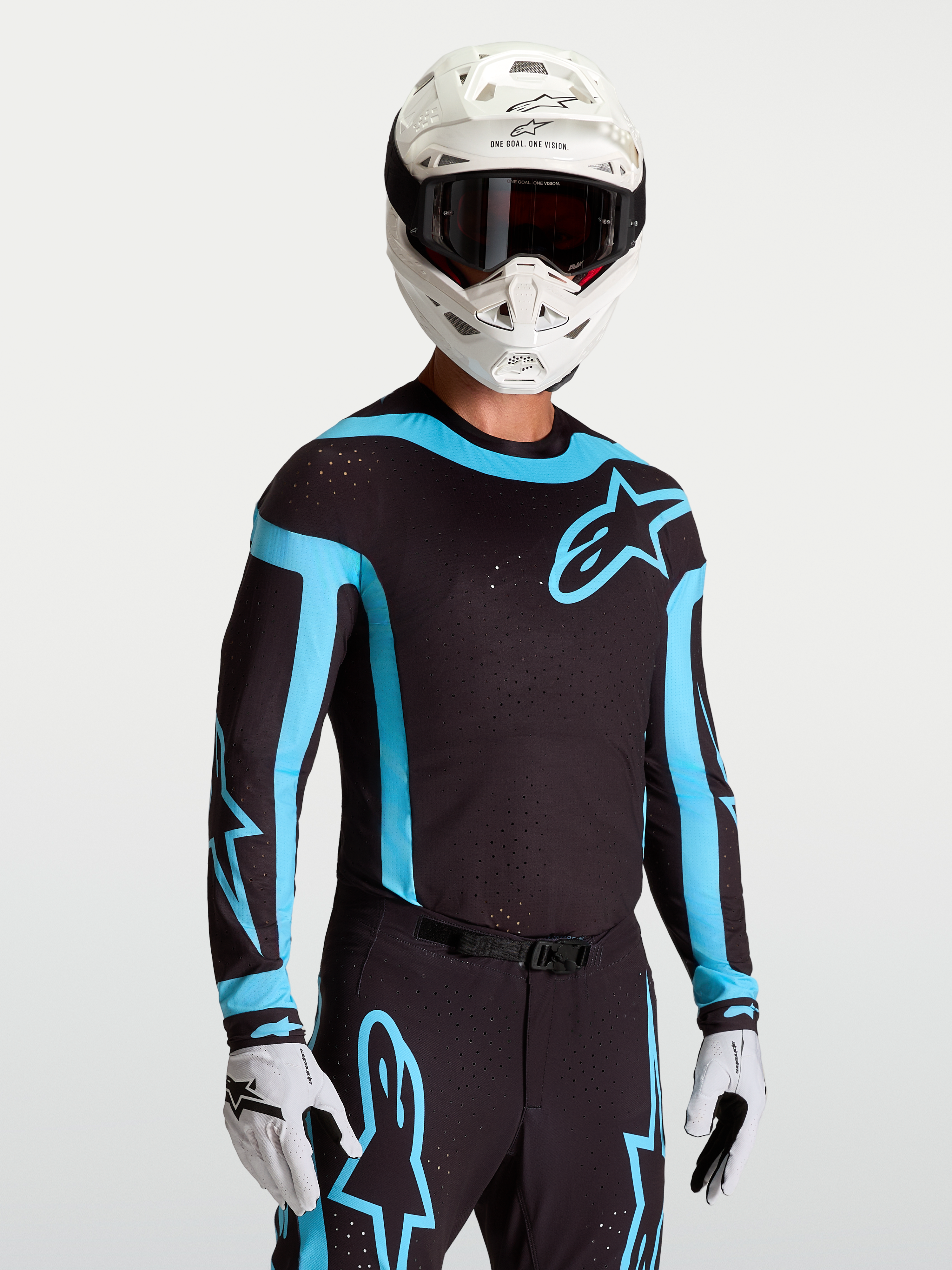Jersey Alpinestars Supertech Vesta, jersey de motocross para hombre, negro y turquesa, con perforaciones láser y ajuste atlético.