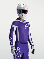 Alpinestars Supertech Vesta, jersey de motocross azul oscuro y blanco, ajuste atlético y ventilación láser, usado por piloto